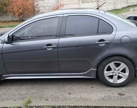 Серый Мицубиси Лансер, объемом двигателя 2 л и пробегом 189 тыс. км за 6800 $, фото 3 на Automoto.ua