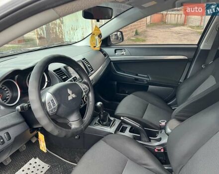 Серый Мицубиси Лансер, объемом двигателя 2 л и пробегом 180 тыс. км за 6799 $, фото 12 на Automoto.ua