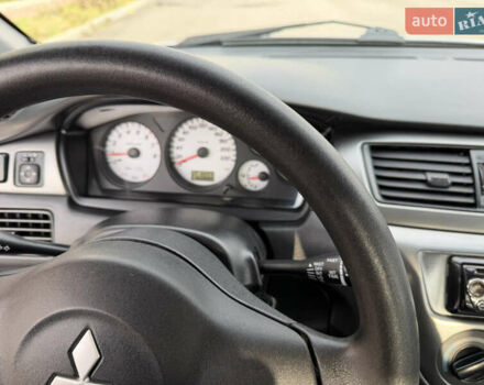 Серый Мицубиси Лансер, объемом двигателя 1.3 л и пробегом 160 тыс. км за 5555 $, фото 44 на Automoto.ua