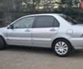 Сірий Міцубісі Lancer, об'ємом двигуна 1.6 л та пробігом 213 тис. км за 3600 $, фото 13 на Automoto.ua