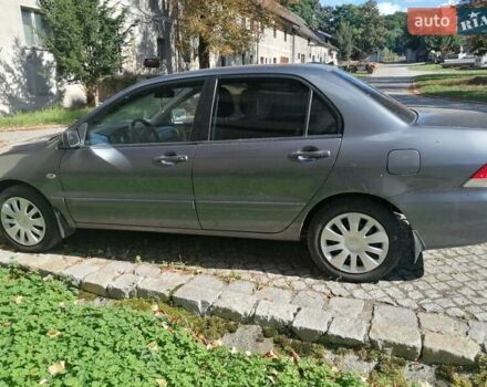 Серый Мицубиси Лансер, объемом двигателя 1.6 л и пробегом 205 тыс. км за 3800 $, фото 3 на Automoto.ua