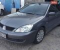 Сірий Міцубісі Lancer, об'ємом двигуна 1.6 л та пробігом 390 тис. км за 1900 $, фото 1 на Automoto.ua
