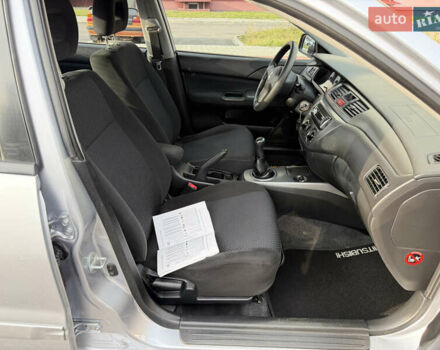 Серый Мицубиси Лансер, объемом двигателя 1.3 л и пробегом 160 тыс. км за 5555 $, фото 64 на Automoto.ua