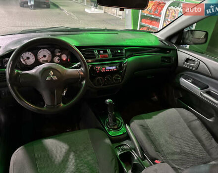 Серый Мицубиси Лансер, объемом двигателя 1.6 л и пробегом 112 тыс. км за 2800 $, фото 16 на Automoto.ua