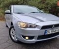 Серый Мицубиси Лансер, объемом двигателя 2 л и пробегом 213 тыс. км за 6550 $, фото 1 на Automoto.ua