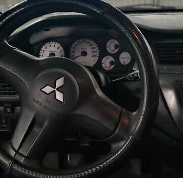 Серый Мицубиси Лансер, объемом двигателя 1.58 л и пробегом 400 тыс. км за 5000 $, фото 6 на Automoto.ua