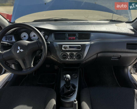 Серый Мицубиси Лансер, объемом двигателя 1.58 л и пробегом 261 тыс. км за 4500 $, фото 3 на Automoto.ua