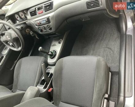 Сірий Міцубісі Lancer, об'ємом двигуна 1.59 л та пробігом 44 тис. км за 6200 $, фото 1 на Automoto.ua