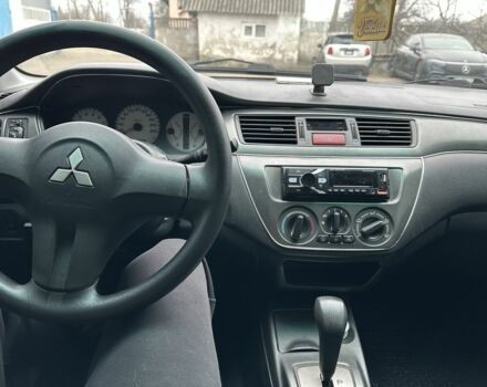 Серый Мицубиси Лансер, объемом двигателя 1.6 л и пробегом 298 тыс. км за 3600 $, фото 7 на Automoto.ua