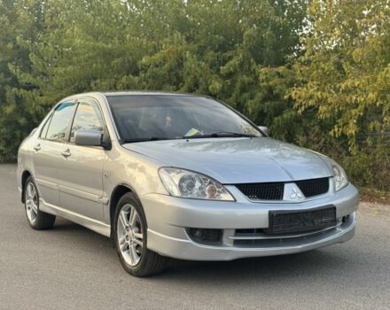 Серый Мицубиси Лансер, объемом двигателя 2 л и пробегом 185 тыс. км за 4600 $, фото 1 на Automoto.ua
