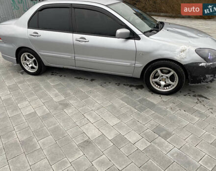 Серый Мицубиси Лансер, объемом двигателя 1.6 л и пробегом 263 тыс. км за 2350 $, фото 5 на Automoto.ua