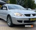 Серый Мицубиси Лансер, объемом двигателя 1.6 л и пробегом 285 тыс. км за 4400 $, фото 1 на Automoto.ua