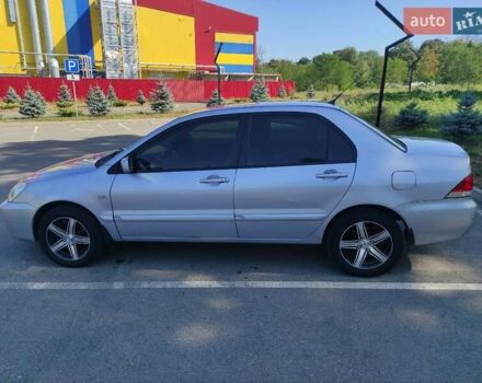 Серый Мицубиси Лансер, объемом двигателя 1.6 л и пробегом 187 тыс. км за 4500 $, фото 3 на Automoto.ua