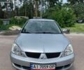 Сірий Міцубісі Lancer, об'ємом двигуна 1.58 л та пробігом 253 тис. км за 4100 $, фото 1 на Automoto.ua