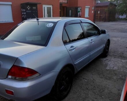 Серый Мицубиси Лансер, объемом двигателя 1.6 л и пробегом 302 тыс. км за 3200 $, фото 1 на Automoto.ua