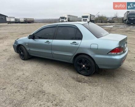 Сірий Міцубісі Lancer, об'ємом двигуна 1.58 л та пробігом 341 тис. км за 4500 $, фото 8 на Automoto.ua