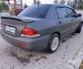 Серый Мицубиси Лансер, объемом двигателя 1.6 л и пробегом 290 тыс. км за 2500 $, фото 2 на Automoto.ua