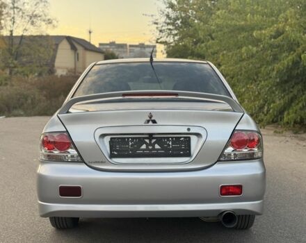 Серый Мицубиси Лансер, объемом двигателя 2 л и пробегом 185 тыс. км за 4600 $, фото 5 на Automoto.ua