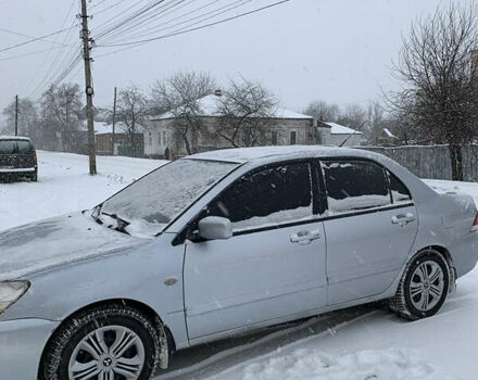 Серый Мицубиси Лансер, объемом двигателя 1.6 л и пробегом 248 тыс. км за 3000 $, фото 4 на Automoto.ua