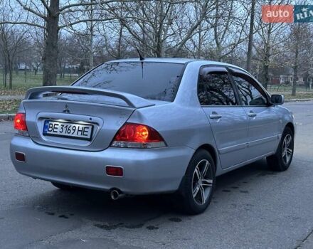 Серый Мицубиси Лансер, объемом двигателя 1.6 л и пробегом 210 тыс. км за 4600 $, фото 5 на Automoto.ua