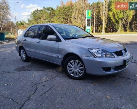 Сірий Міцубісі Lancer, об'ємом двигуна 1.58 л та пробігом 122 тис. км за 6300 $, фото 10 на Automoto.ua