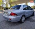 Сірий Міцубісі Lancer, об'ємом двигуна 1.58 л та пробігом 122 тис. км за 6300 $, фото 12 на Automoto.ua