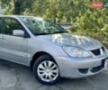 Сірий Міцубісі Lancer, об'ємом двигуна 1.58 л та пробігом 138 тис. км за 4990 $, фото 1 на Automoto.ua