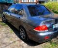 Сірий Міцубісі Lancer, об'ємом двигуна 1.6 л та пробігом 270 тис. км за 4500 $, фото 1 на Automoto.ua