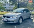Сірий Міцубісі Lancer, об'ємом двигуна 1.58 л та пробігом 138 тис. км за 4990 $, фото 3 на Automoto.ua