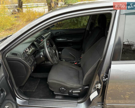 Сірий Міцубісі Lancer, об'ємом двигуна 1.58 л та пробігом 247 тис. км за 4900 $, фото 17 на Automoto.ua