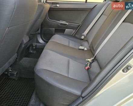 Серый Мицубиси Лансер, объемом двигателя 2 л и пробегом 282 тыс. км за 5450 $, фото 68 на Automoto.ua