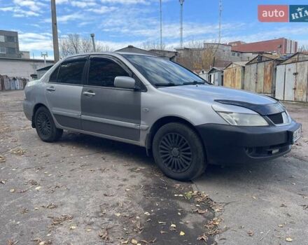 Сірий Міцубісі Lancer, об'ємом двигуна 1.58 л та пробігом 305 тис. км за 3300 $, фото 5 на Automoto.ua