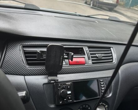 Серый Мицубиси Лансер, объемом двигателя 1.6 л и пробегом 238 тыс. км за 4300 $, фото 9 на Automoto.ua