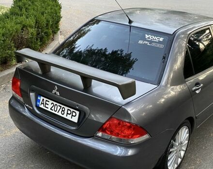 Серый Мицубиси Лансер, объемом двигателя 1.6 л и пробегом 250 тыс. км за 3999 $, фото 5 на Automoto.ua