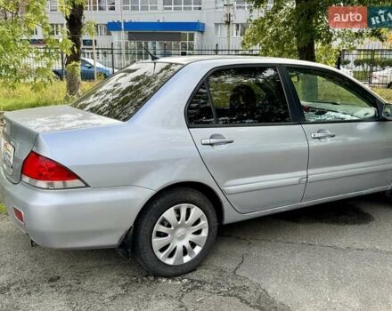 Сірий Міцубісі Lancer, об'ємом двигуна 1.58 л та пробігом 138 тис. км за 4990 $, фото 12 на Automoto.ua