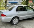 Сірий Міцубісі Lancer, об'ємом двигуна 1.58 л та пробігом 138 тис. км за 4990 $, фото 12 на Automoto.ua