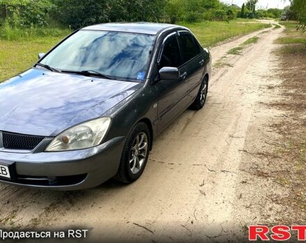 Серый Мицубиси Лансер, объемом двигателя 1.6 л и пробегом 212 тыс. км за 4600 $, фото 4 на Automoto.ua