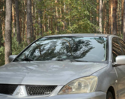 Серый Мицубиси Лансер, объемом двигателя 1.6 л и пробегом 248 тыс. км за 3000 $, фото 7 на Automoto.ua