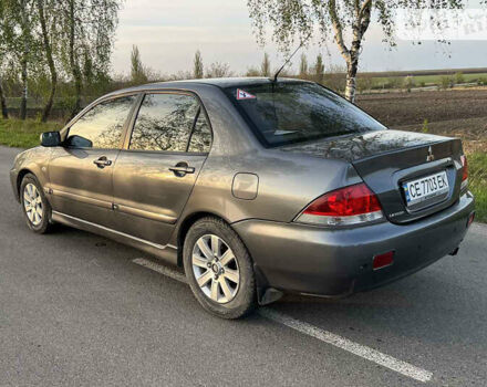 Сірий Міцубісі Lancer, об'ємом двигуна 1.6 л та пробігом 207 тис. км за 4800 $, фото 3 на Automoto.ua