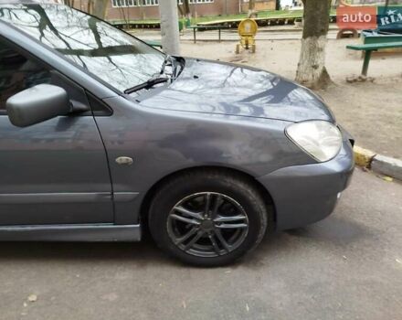 Сірий Міцубісі Lancer, об'ємом двигуна 1.58 л та пробігом 250 тис. км за 4750 $, фото 4 на Automoto.ua