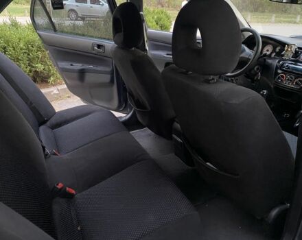 Серый Мицубиси Лансер, объемом двигателя 1.6 л и пробегом 250 тыс. км за 3999 $, фото 8 на Automoto.ua