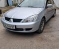 Сірий Міцубісі Lancer, об'ємом двигуна 1.6 л та пробігом 122 тис. км за 5500 $, фото 1 на Automoto.ua