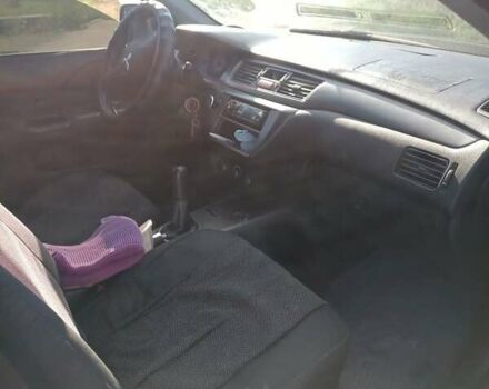 Серый Мицубиси Лансер, объемом двигателя 1.58 л и пробегом 300 тыс. км за 4400 $, фото 9 на Automoto.ua