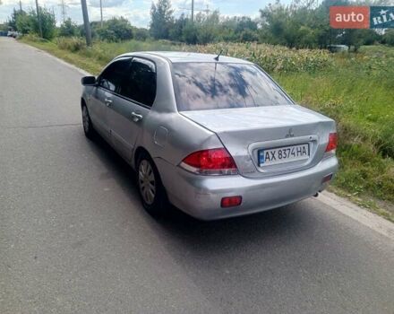 Серый Мицубиси Лансер, объемом двигателя 1.58 л и пробегом 200 тыс. км за 2300 $, фото 7 на Automoto.ua