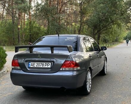 Серый Мицубиси Лансер, объемом двигателя 1.6 л и пробегом 250 тыс. км за 3999 $, фото 2 на Automoto.ua