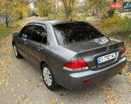 Сірий Міцубісі Lancer, об'ємом двигуна 1.58 л та пробігом 247 тис. км за 4900 $, фото 13 на Automoto.ua