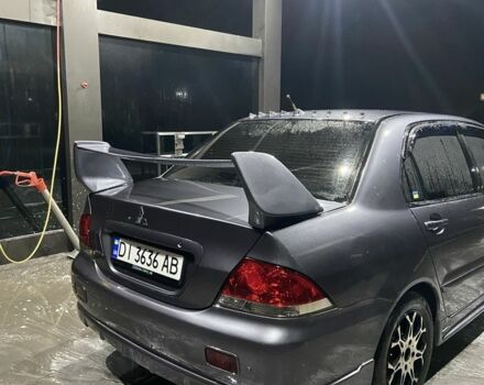 Серый Мицубиси Лансер, объемом двигателя 1.6 л и пробегом 280 тыс. км за 4000 $, фото 1 на Automoto.ua