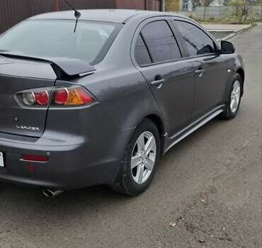Серый Мицубиси Лансер, объемом двигателя 2 л и пробегом 189 тыс. км за 6800 $, фото 4 на Automoto.ua