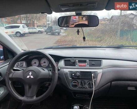 Серый Мицубиси Лансер, объемом двигателя 1.6 л и пробегом 218 тыс. км за 5000 $, фото 2 на Automoto.ua
