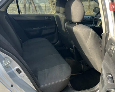 Серый Мицубиси Лансер, объемом двигателя 1.58 л и пробегом 290 тыс. км за 3750 $, фото 8 на Automoto.ua